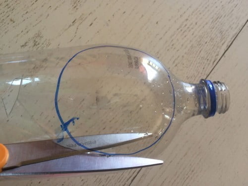 cutting out DIY magnifying glass
